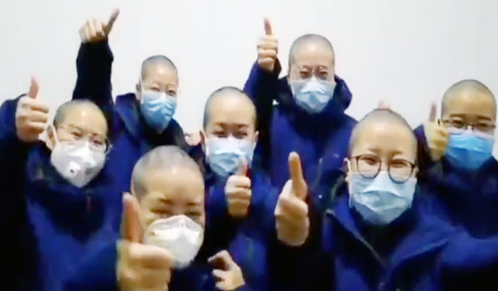 Coronavirus: Chinese nurses shaving heads