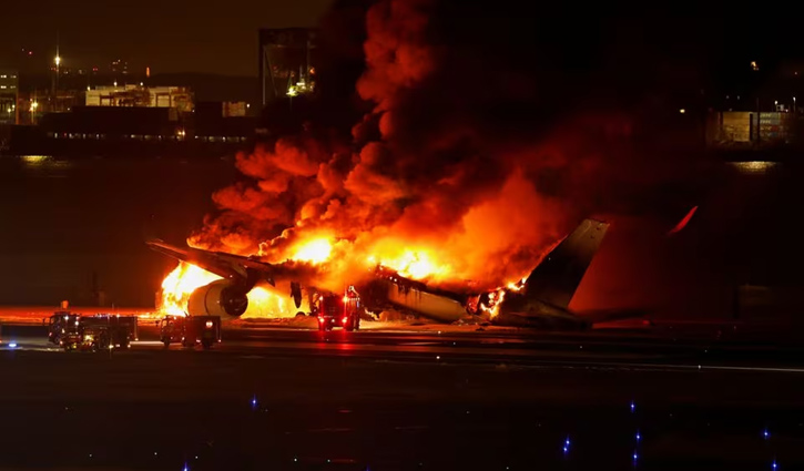 Japan Airlines plane engulfed in flames