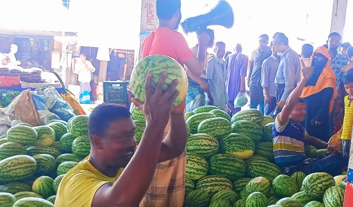 Watermelons being sold by miking