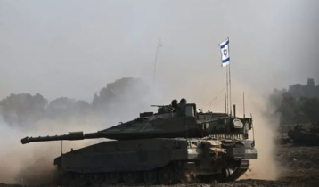 Israeli tanks ram through gates of UN base